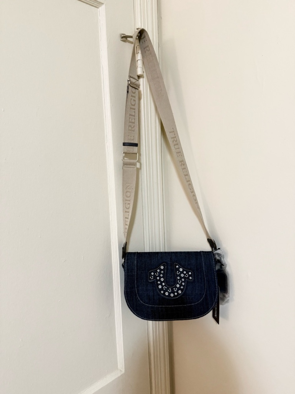 True Religion Dark Denim Crossbody with Ivory Logo Strap